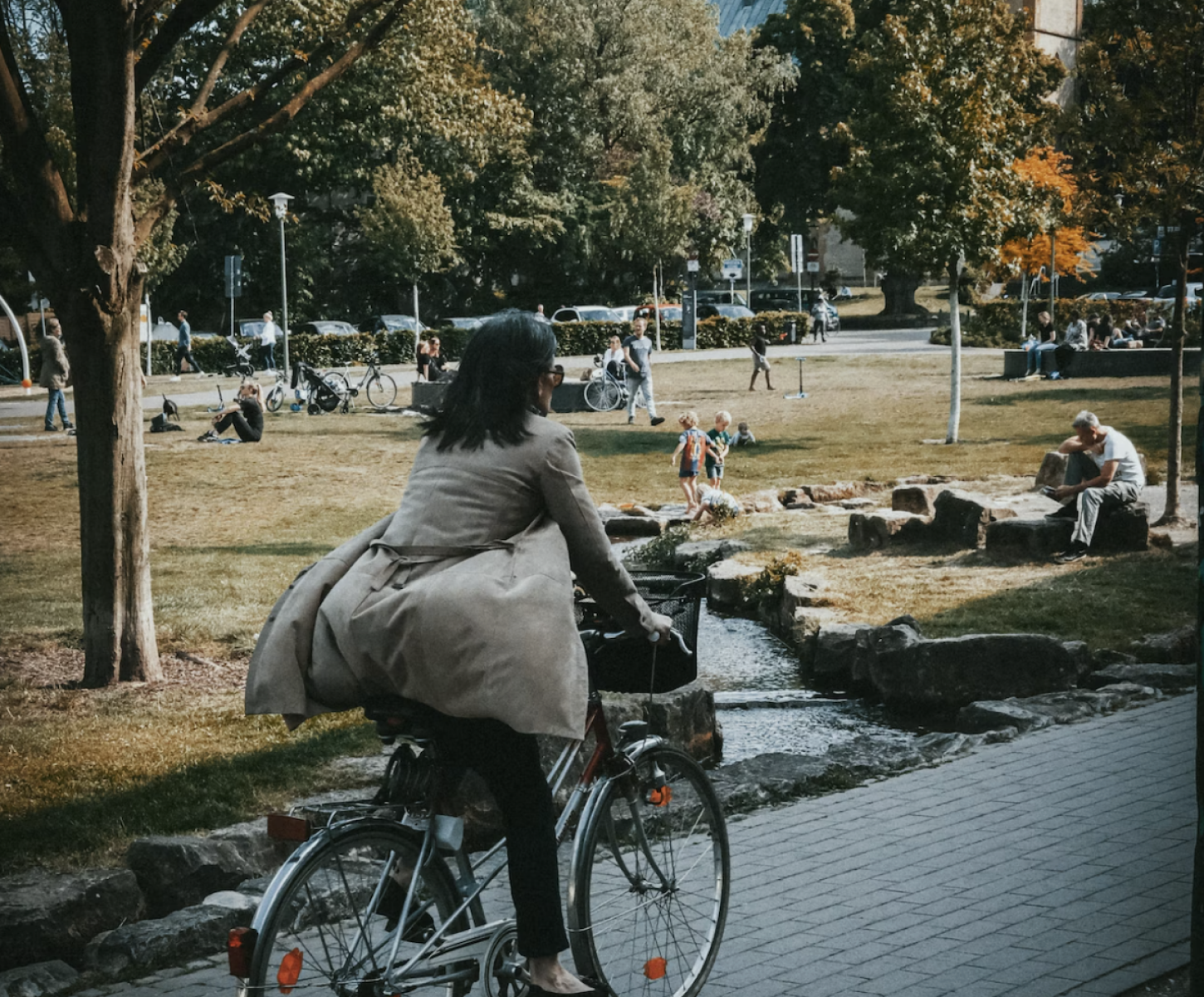 Commuter biking to work through the park